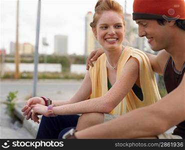 Young couple embracing in street