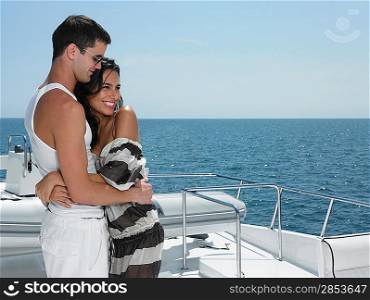 Young couple embracing on yacht