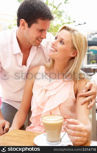 Young Couple Enjoying Coffee In CafZ