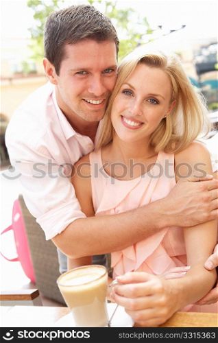 Young Couple Enjoying Coffee In CafZ