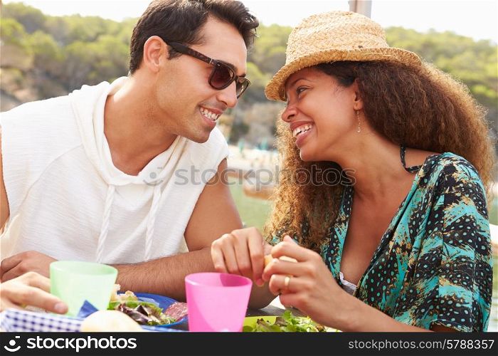 Young Couple Enjoying Lunch Outdoors Together