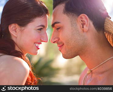 Young couple face to face, smiling
