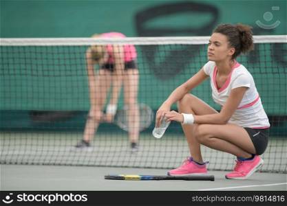 young couple finish a tennis match