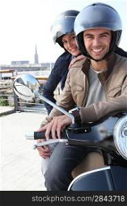 Young couple having a motorbike ride