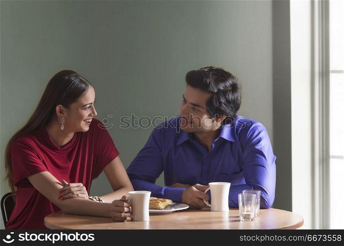 Young couple having breakfast together