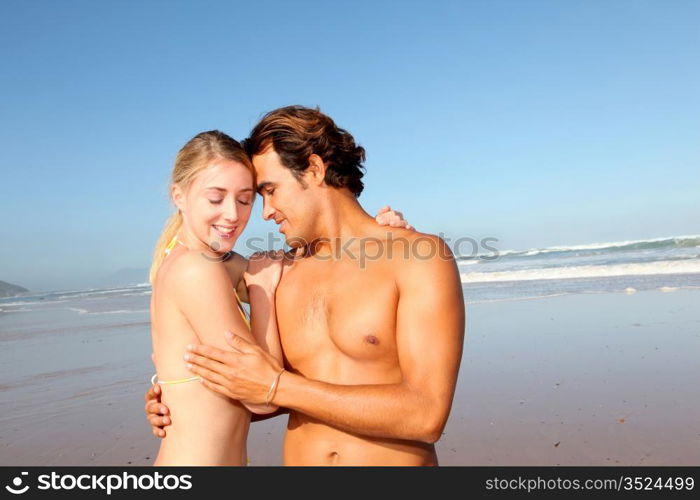 Young couple having fun at the beach