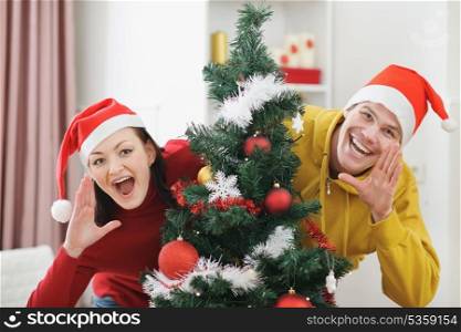 Young couple having fun Christmas time