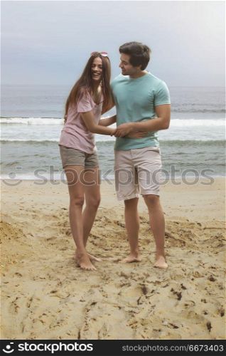 Young couple having fun on beach