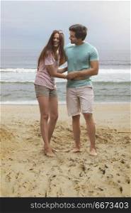 Young couple having fun on beach