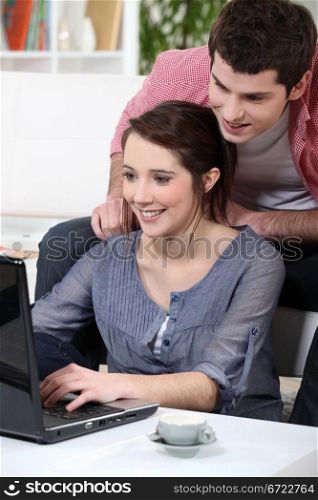 young couple having fun on the Internet