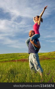 Young couple having good time on a beautiful springfield