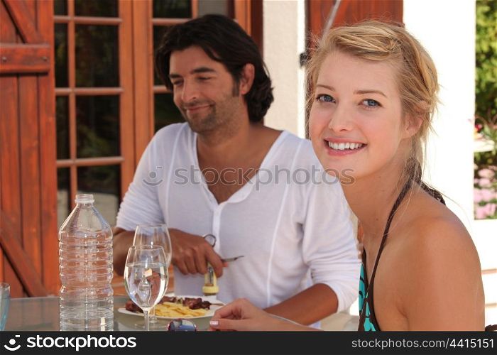 Young couple having lunch alfresco