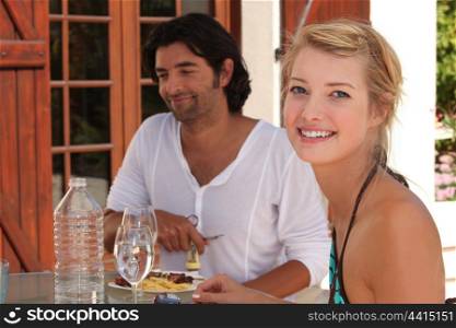 Young couple having lunch alfresco