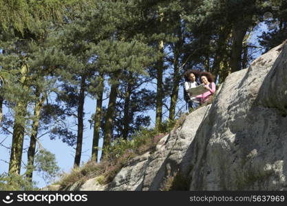 Young Couple Hiking Through Countryside