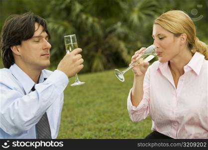 Young couple holding champagne flutes