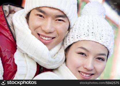 Young couple holding red lantern