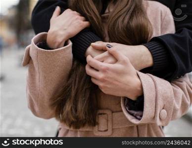 young couple hugging close up