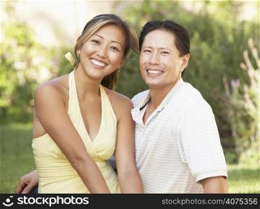 Young Couple Hugging In Garden