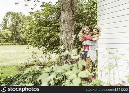 Young couple hugging in garden
