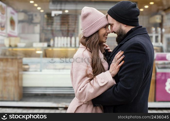 young couple hugging looking each other 2