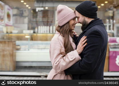 young couple hugging looking each other 2