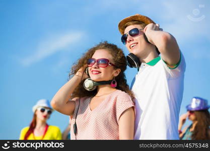 Young couple. Image of young people having fun outdoors