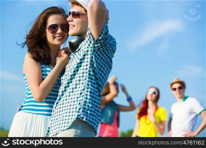 Young couple. Image of young people having fun outdoors