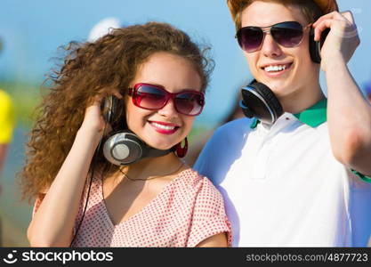 Young couple. Image of young people having fun outdoors
