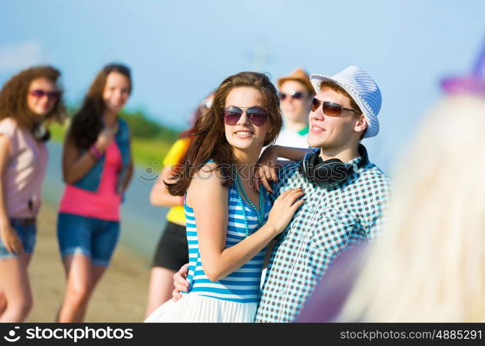 Young couple. Image of young people having fun outdoors