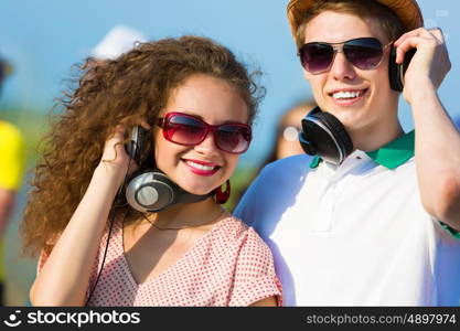 Young couple. Image of young people having fun outdoors