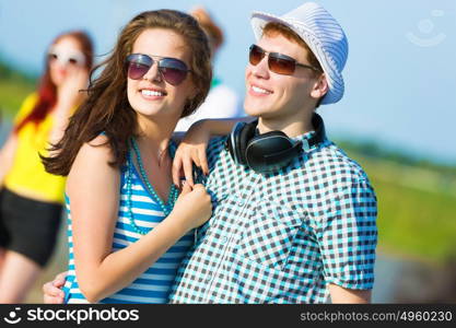 Young couple. Image of young people having fun outdoors