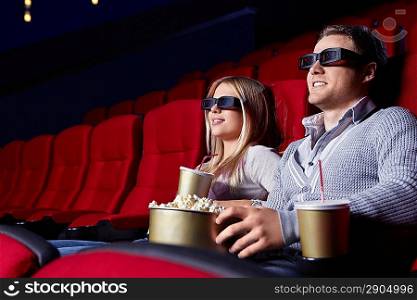 Young couple in 3D cinema