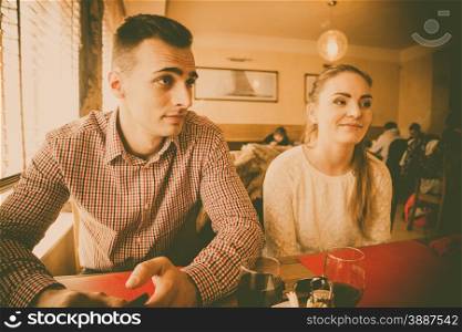 Young couple in a cafe filtered photo