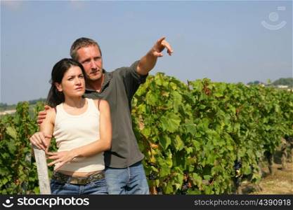 Young couple in a vineyard