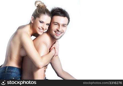 Young couple in blue jeans on white background