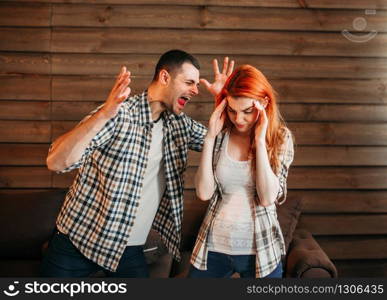 Young couple in conflict, man and woman fight. Husband and wife quarrel. Problem relationship. Young couple in conflict, man and woman fight