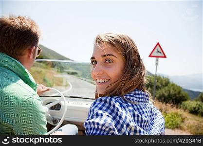 Young couple in convertible car