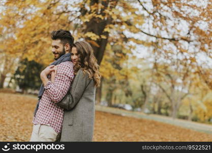 Young couple in love in the autumn forest