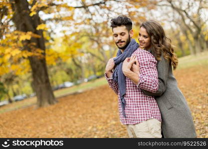 Young couple in love in the autumn forest