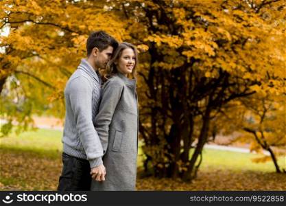 Young couple in love in the autumn forest