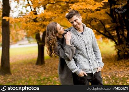 Young couple in love in the autumn forest