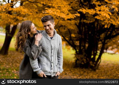 Young couple in love in the autumn forest