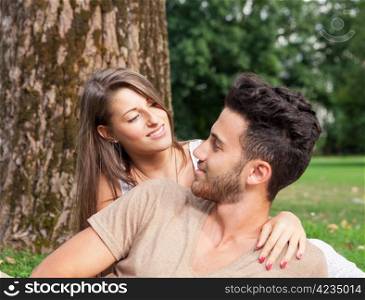 Young couple in love looking each other while smiling