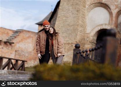 Young couple in love outdoor.Stunning sensual outdoor portrait of young stylish fashion couple posing in summer in field. couple walking in the city. selective focus