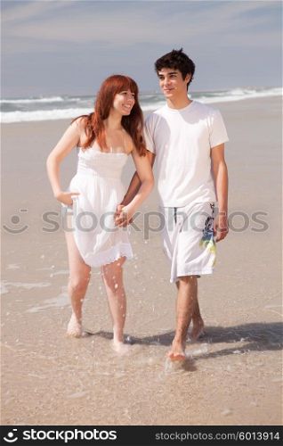 Young couple in love, relaxing at the beach