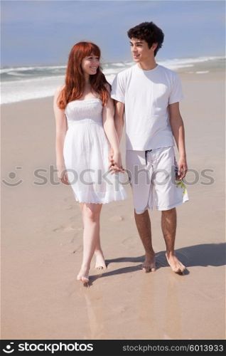 Young couple in love, relaxing at the beach