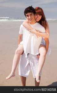 Young couple in love, relaxing at the beach