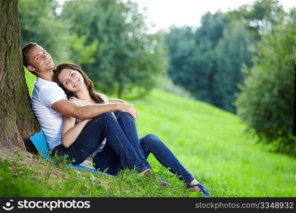 Young couple in love with a tree