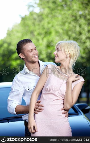 Young couple in love with cars