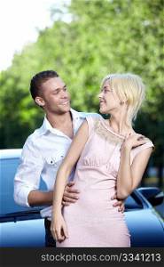 Young couple in love with cars